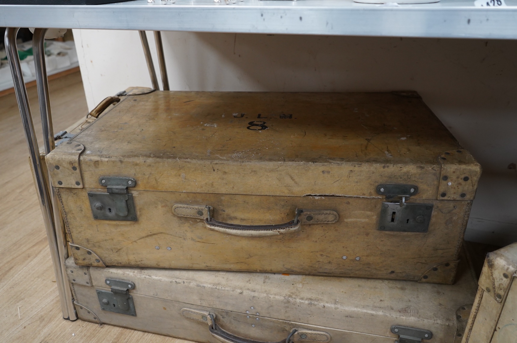 A collection of luggage comprising four vintage trunks and a hat box
